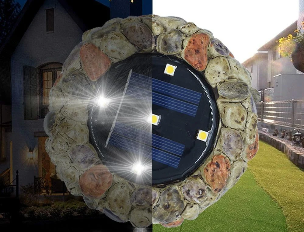 Kobblestensformad solcellsdriven LED-lampa i keramik och plast för trädgårdsrabatter