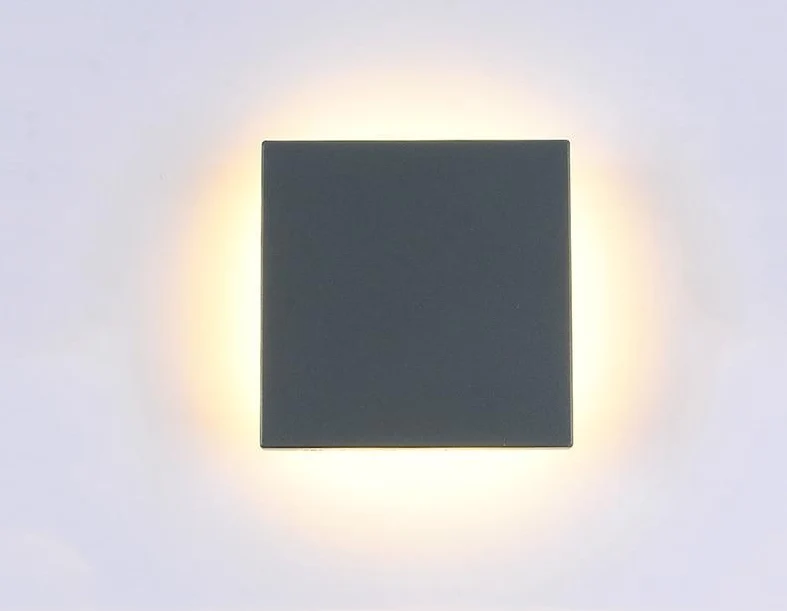 Nowoczesna lampa ścienna Enid w kształcie dysku z aluminium do odbijania światła na zewnątrz